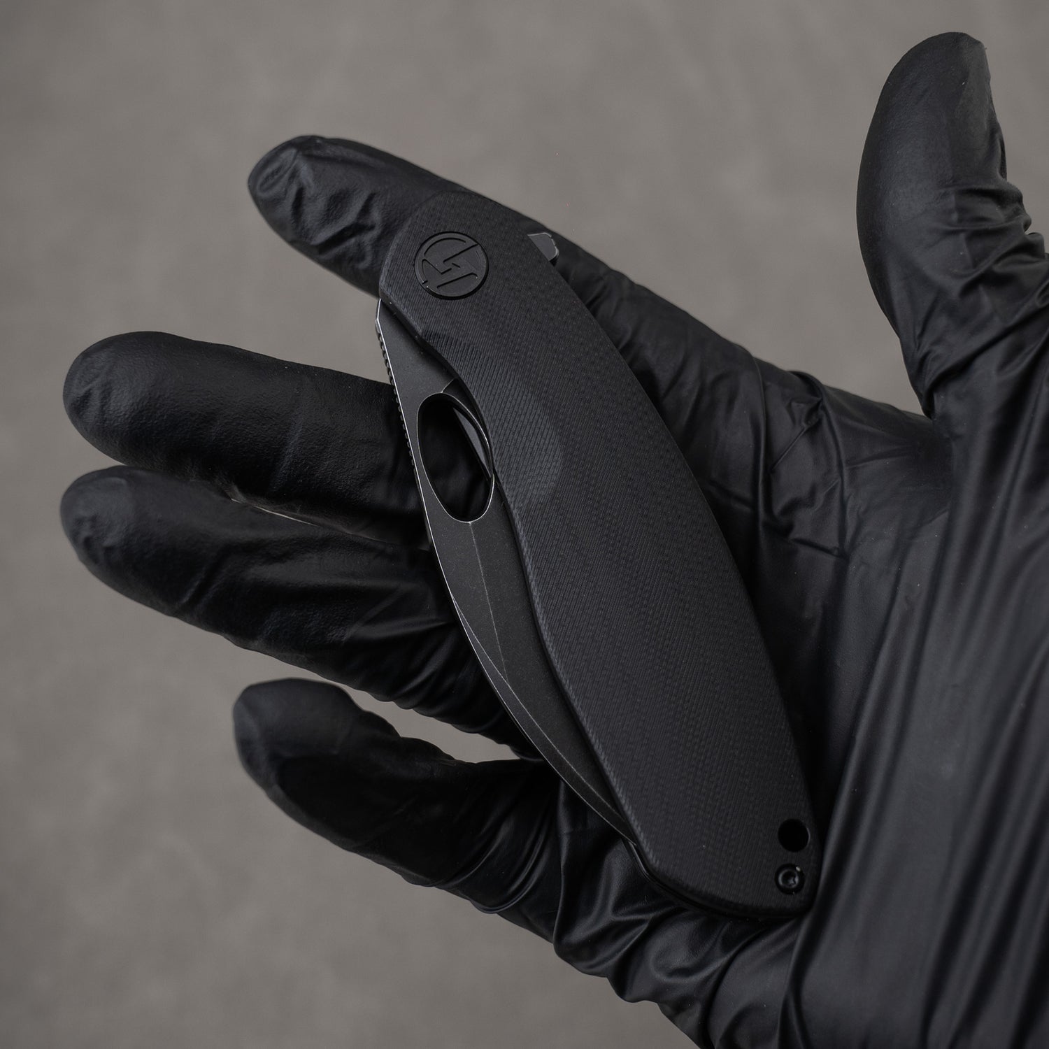 All black G064 closed in hand