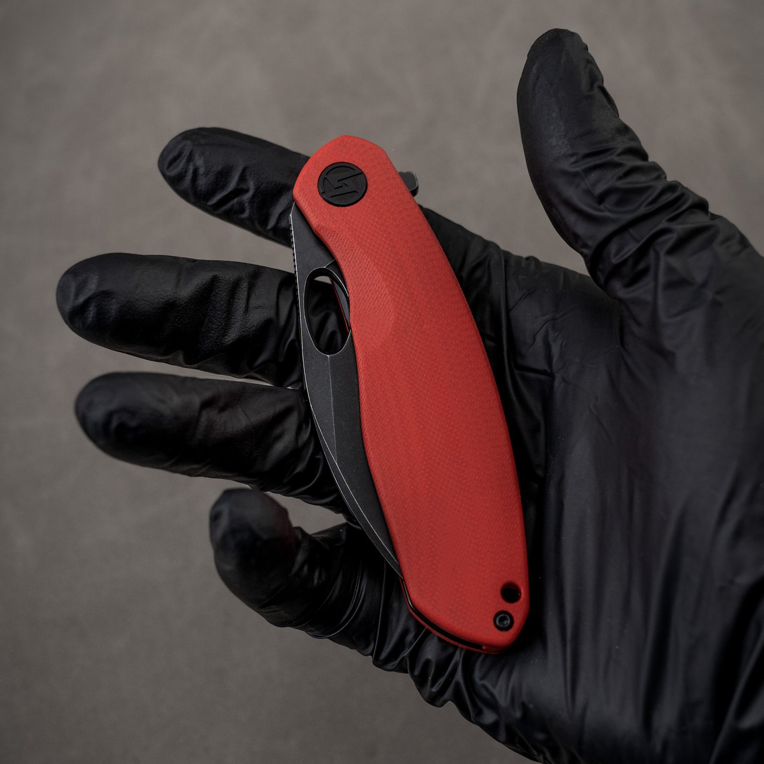 Closed G064 with red G10 and black blade